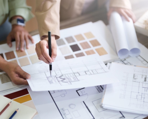 Interior architect working with blueprint planning in modern office